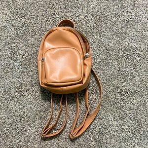 wild and fable brown/tan backpack with three pockets